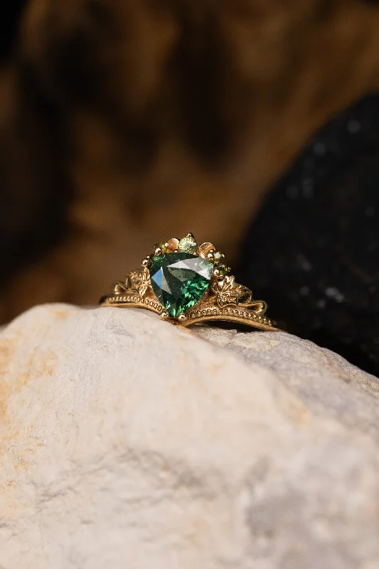 Men's Black Onyx Engagement Rings Set in Titanium for a Modern and Bold LookREADY TO SHIP: Ariadne engagement ring in 14K yellow gold, natural green/teal sapphire, accent natural green sapphires, AVAILABLE RING SIZES: 7.5 - 10.5 US