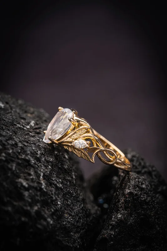 Men's Moonstone Engagement Rings in Silver - Plated Copper with a Celtic Knot PatternREADY TO SHIP: Ikar ring in 14K yellow gold, moonstone pear cut 10x7 mm, accent lab grown diamonds, AVAILABLE RING SIZES: 5.5 - 8.5 US