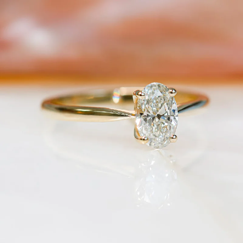Men's Tanzanite Engagement Rings in Palladium with a Three - Stone ArrangementTai-Yang Descending Natural Oval Diamond Engagement Ring Men's Tanzanite Engagement Rings in Palladium with a Three - Stone ArrangementTai-Yang Descending Natural Oval Diamond Engagement Ring