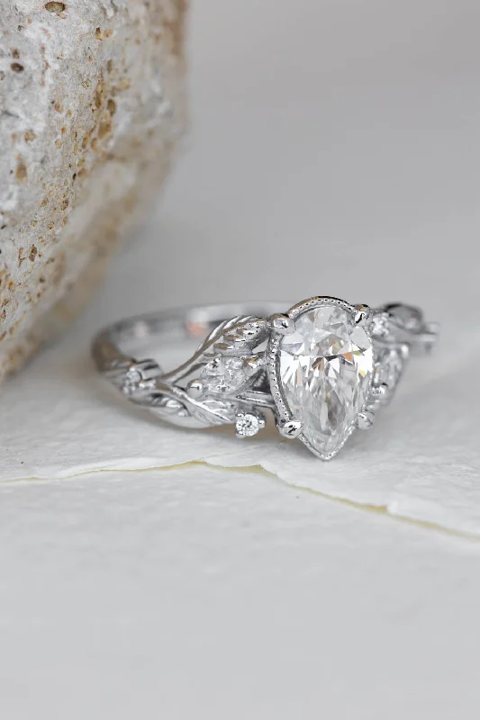 Men's Ruby Engagement Rings in Rose Gold with a Solitaire Design for a Romantic GestureREADY TO SHIP: Patricia ring in 14K white gold, lab grown diamond pear cut 8x6 mm, accent lab grown diamonds, AVAILABLE RING SIZES: 6 - 9 US