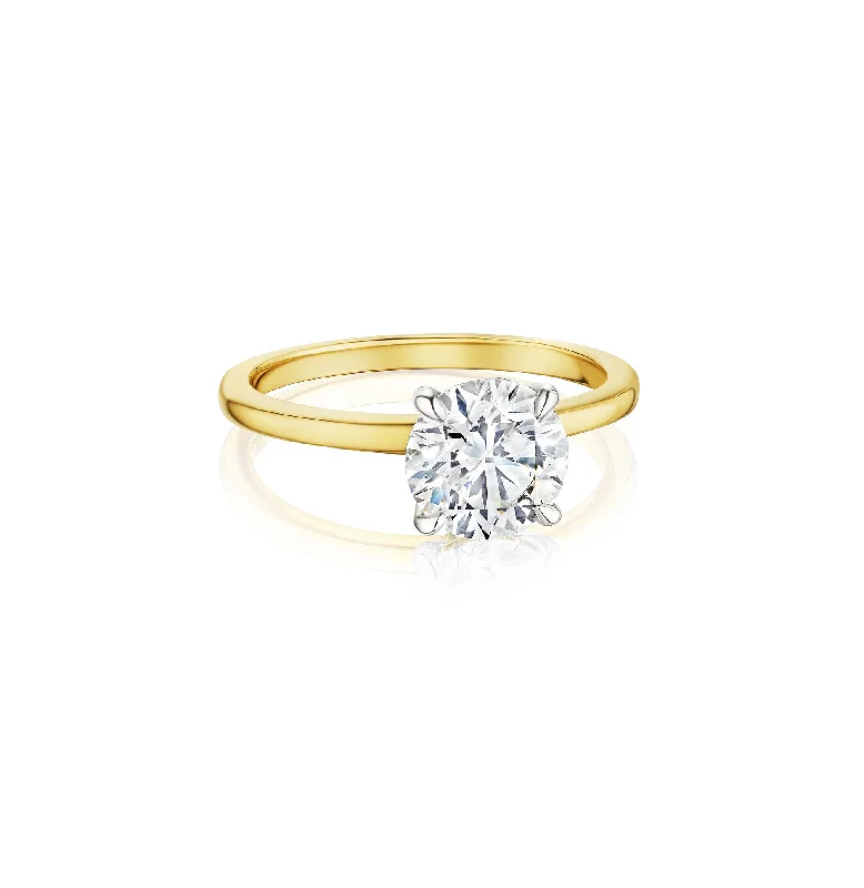 Men's Diamond Engagement Rings with Platinum Band and Halo Setting for a Luxury ProposalFink's Exclusive Round Diamond Solitaire Ring in White and Yellow Gold