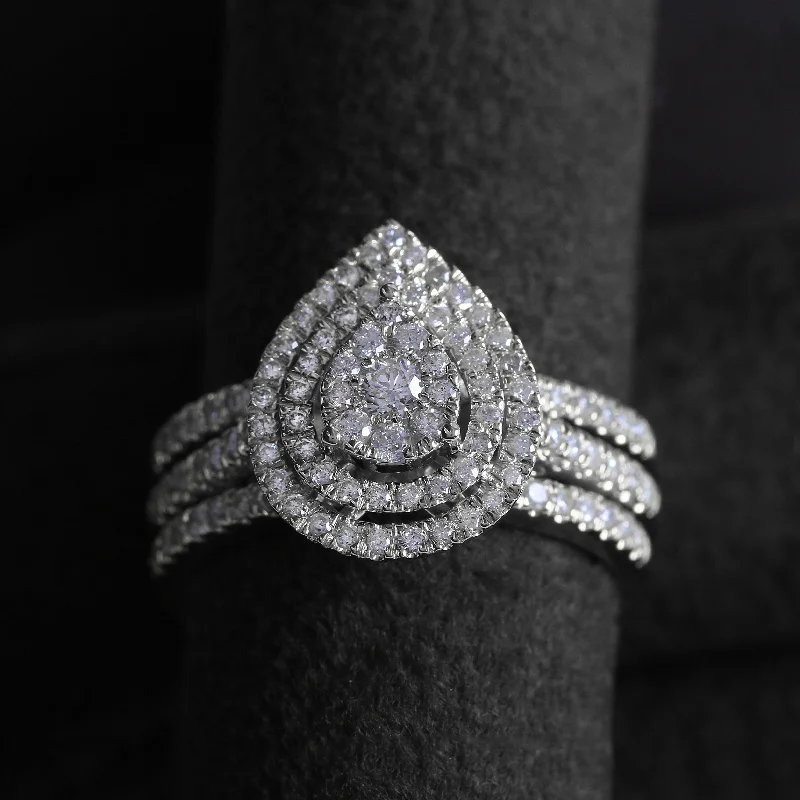 Cluster Engagement Rings with Multiple Small Diamonds Arranged in a Stunning DesignCertified 1ct TDW Pear Shaped Cluster Halo Bridal Set by De Couer Cluster Engagement Rings with Multiple Small Diamonds Arranged in a Stunning DesignCertified 1ct TDW Pear Shaped Cluster Halo Bridal Set by De Couer